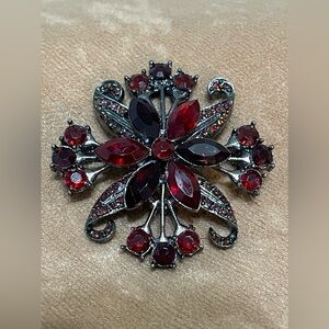 Dramatic red rhinestone signed Star in Circle Hallmark Silverstone brooch